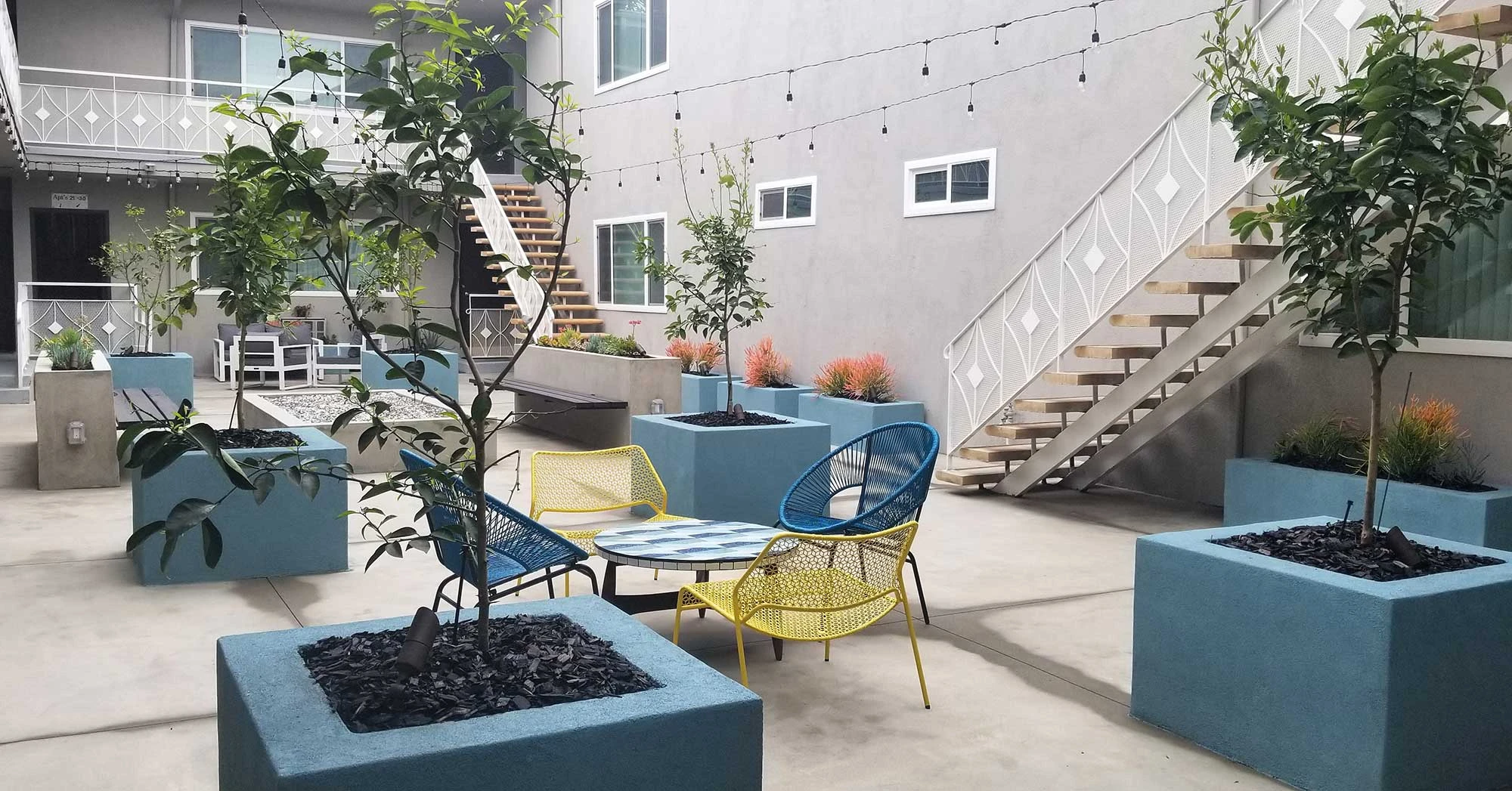 Bleu Apartments outdoor lounge mid century chairs seating
