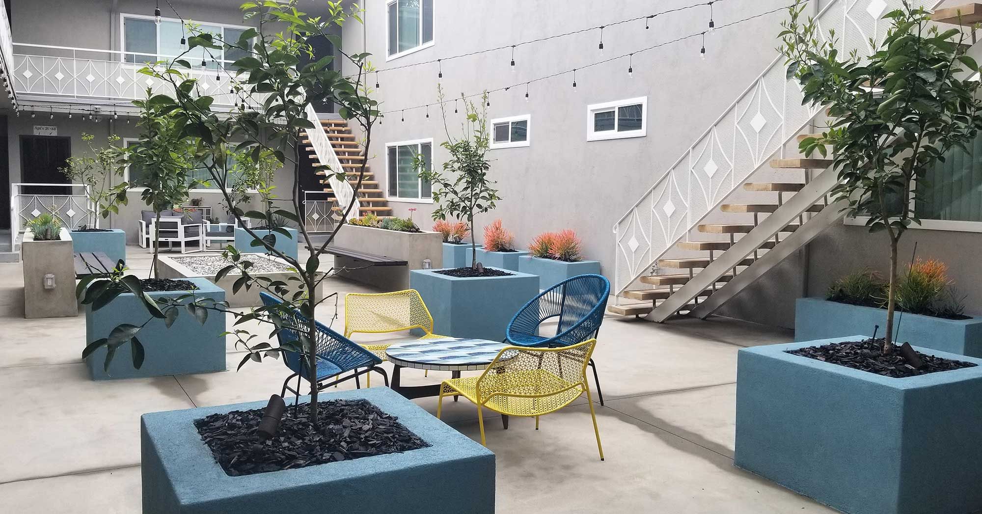 Bleu Apartments outdoor lounge with mid-century seating