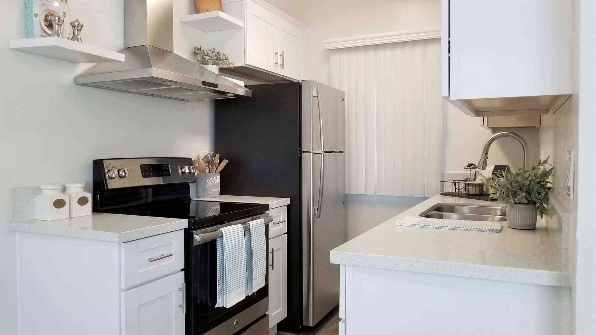 modern kitchen with stainless steel fridge