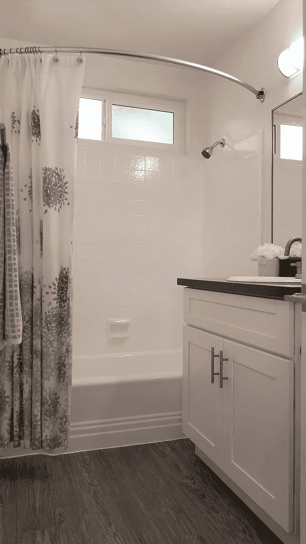 full bathroom with tiled shower and tub