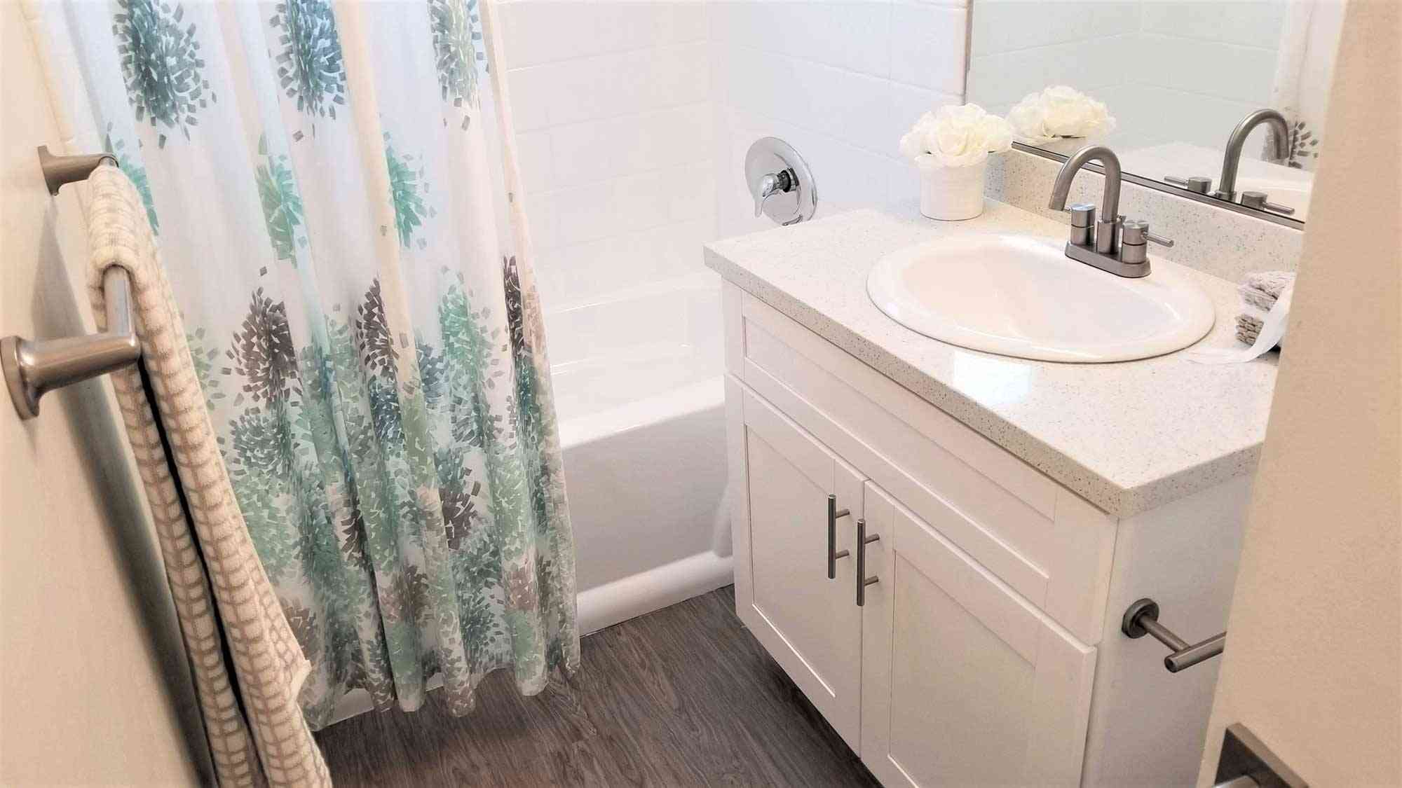modern bathroom white cabinetry quartz counters