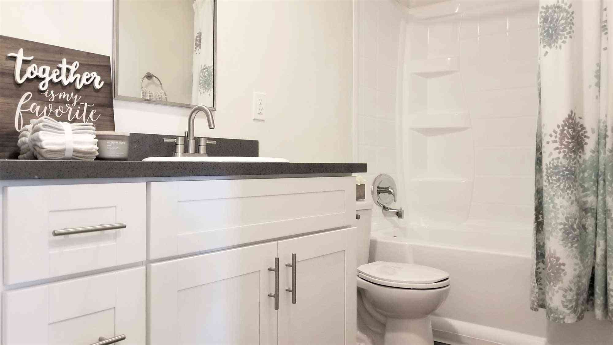 bathroom vanity with brushed nickel fixtures